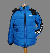 Load image into Gallery viewer, BOY SIZE 7 YEARS - DKNY Blue Hooded Puffer Jacket EUC

Soft, fleece lined, removable hood, warm.

Very gentle signs of wash wear on fleece.

This is a generously sized coat. Can definitely wear it for much longer. 

