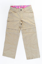 Load image into Gallery viewer, Bomber pant/short for camping or hiking trips, this versatile convertible pant features zip-off legs; converting this pant into a 4” short for warmer weather. Adjustable elastic waistband and exterior drawstring provide a bit of growing room.

GIRL SIZE XS (6 YEARS) NORTH FACE GIRLS&#39; CONVERTIBLE PANTS NWOT 

