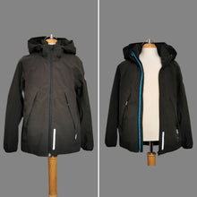 Load image into Gallery viewer, BOY SIZE 7/8 YEARS - REIMA Black Hooded Jacket EUC

High quality brand that&#39;s stylish and made really well. Perfect for spring and fall weather.  

Removable hood, reflective strips, side zippers, adjustable straps on inside, lined. 

Note* there is a stain on the back (see pic for reference) the actual stain isnt as noticeable in normal lighting. 

